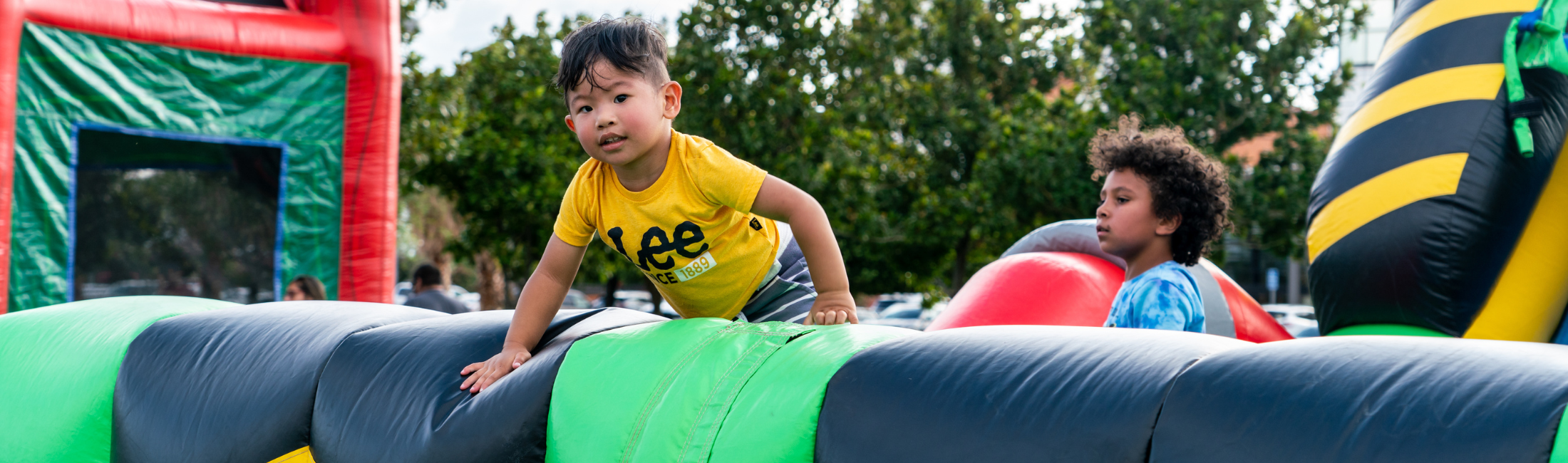 Child on bounce house at National Night Out